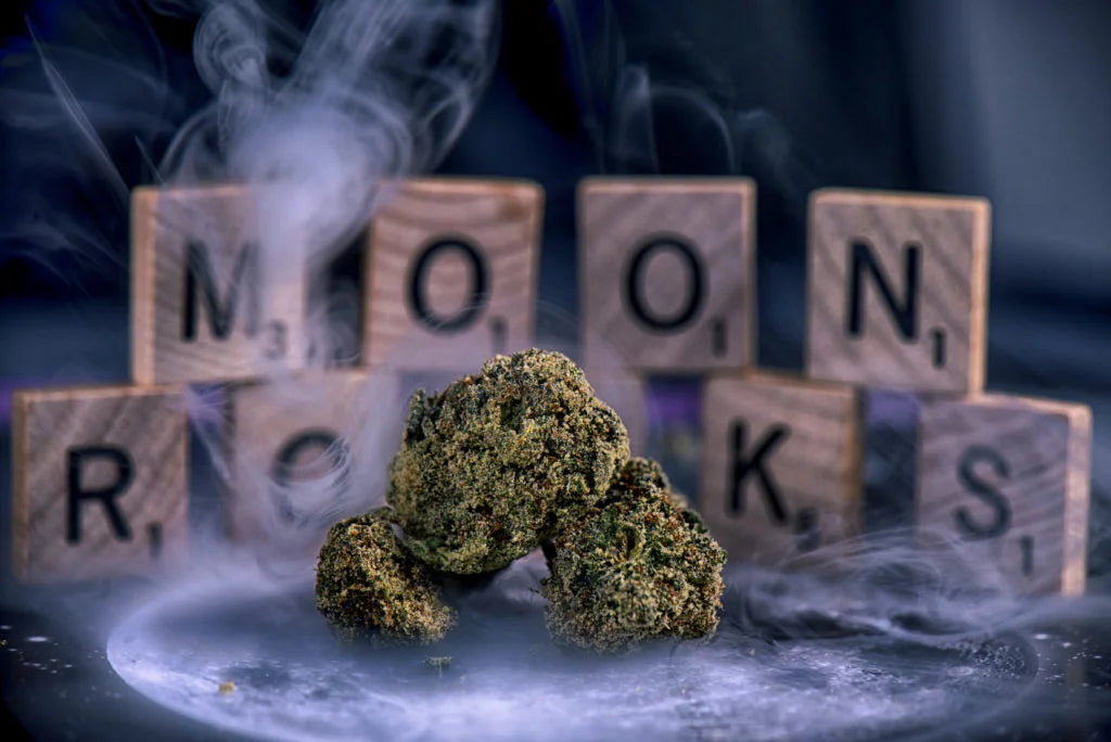 A picture of moon rock weed with the letters behind it.